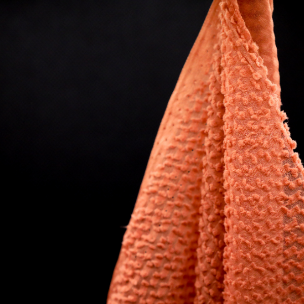 Tissu Plumetis polyester - corail